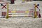 Show jumping barriers on the ground waiting for riders and horses