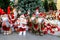 Showcase with Funny Santa Claus, Christmas and New Year toys and decoration. Positive emotions, joy. Festive winter trade, fair