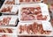 Showcase meat raw products in a supermarket