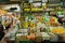 Showcase with spices, noodles, sauce, dry fruits and vegetables inside asian food market