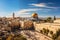 Showcasing the Western Wall alongside the Dome of the Rock, emphasizing the historical significance