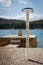 Shower on the beach, berth with bollard in the background