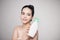 Shower gel. Joyful young woman advertising care product.