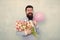 Shower love upon her with flowers. Happy hipster hold tulips and balloon. Love gift. Romantic bouquets for Valentines