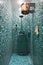 Shower room with blue mosaic in sauna