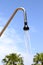 Shower sprinkler on blue sky outdoor water falling