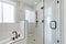 Shower stall with tiles and cohesive plumbing fixtures