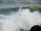 Shower of Water Droplets due to Sea Waves Crashing on Rocks