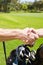 Showing their sportsmanship. Golfing partners shaking hands after a game of golf.