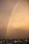 Shows a rainbow in the sky above Rafah on a rainy day at sunset in the southern Gaza Strip