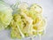 Shredded cabbage With a paring knife On a white plastic chopping board