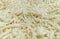 Shredded cheese background.Heap of Grated pizza cheese close up texture