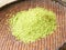 Shredded rice grains in winnowing basket