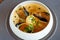 Shrimp Bisque with Seafood. King prawn, blue mussels, cod, whipped cream. Delicious traditional food closeup served for