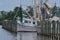 Shrimp boats moored by wooden pylons