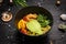 Shrimp bowl with avocado in a black plate