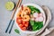 Shrimp Burrito Bowl with brown rice, spinach, radish, black beans, tomato and broccoli.