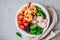 Shrimp Burrito Bowl with brown rice, spinach, radish, black beans, tomato and broccoli.