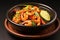 shrimp with chili lime mix on dark ceramic dish