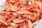 Shrimp cocktail background with a close up view of a group of fresh delicious refrigerated crustaceans as gourmet