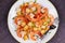 Shrimp with crispy croutons and scallions. View from above, top studio shot.