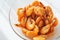 Shrimp food in a bowl. Portion of boiled shrimp in a transparent plate on the table.