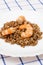 Shrimp fried in oil laid out on white plate buckwheat