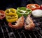 Shrimp grilled on barbecue stove with chilli and onion ring