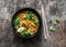 Shrimp laksa soup on a dark wooden background, top view. Copy space. Asian style