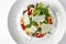 Shrimp salad with fresh vegetables and parmesan. Banquet festive dishes. Gourmet restaurant menu.