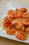 Shrimp scampi gourmet dish in white dish