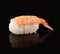 Shrimp sushi on black mirroring background