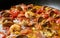 Shrimp in a tomato sauce with mollusks. Italian cuisine. seafood closeup view.