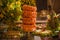 Shrimp tower with table decorated with fruits and cold cakes.