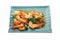 Shrimps fried with fresh herbs in dish