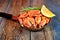 Shrimps, lemon and rosemary in a frying pan