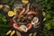 Shrimps and oysters on slate board with herbs and lemons