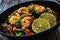 Shrimps, rice noodles, broccoli and shimeji mushrooms on wooden table