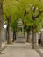 Shrine with statue of a kneeling women in a lane with grave tombs