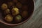 Shriveled quince fruits in rural still life