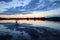 Shrub and clouds in the lake at sunset