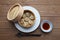 Shumai shaomai Chinese steamed meat dumpling on wooden table