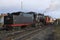 Shunting diesel locomotive TEM18V tows the old Soviet steam locomotive of L-2331