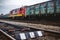 Shunting train with a car working at the railway station.