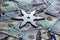 Shuriken Throwing star on a dollar background. Ninja weapons