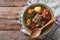 Shurpa lamb soup with vegetables closeup at the plate. horizontal top view