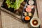 Shushi Japanese Food and salad roll on wooden table