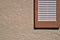 Shutter on exterior stucco wall