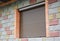 Shutter security barrier. Window with rolling shutter for house protection. Security Shutters Grilles.