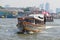 Shuttle passenger boat `Chao Phraya Express Boat` on the Chao Phraya river. Bangkok